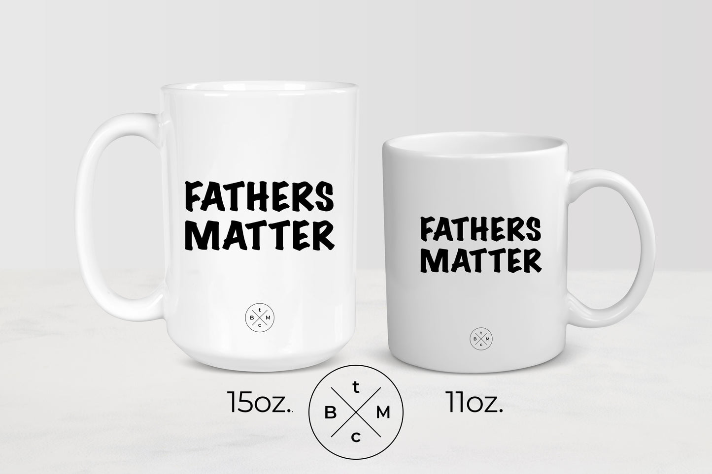 11 ounce and 15 ounce white ceramic mugs with black text fathers matter