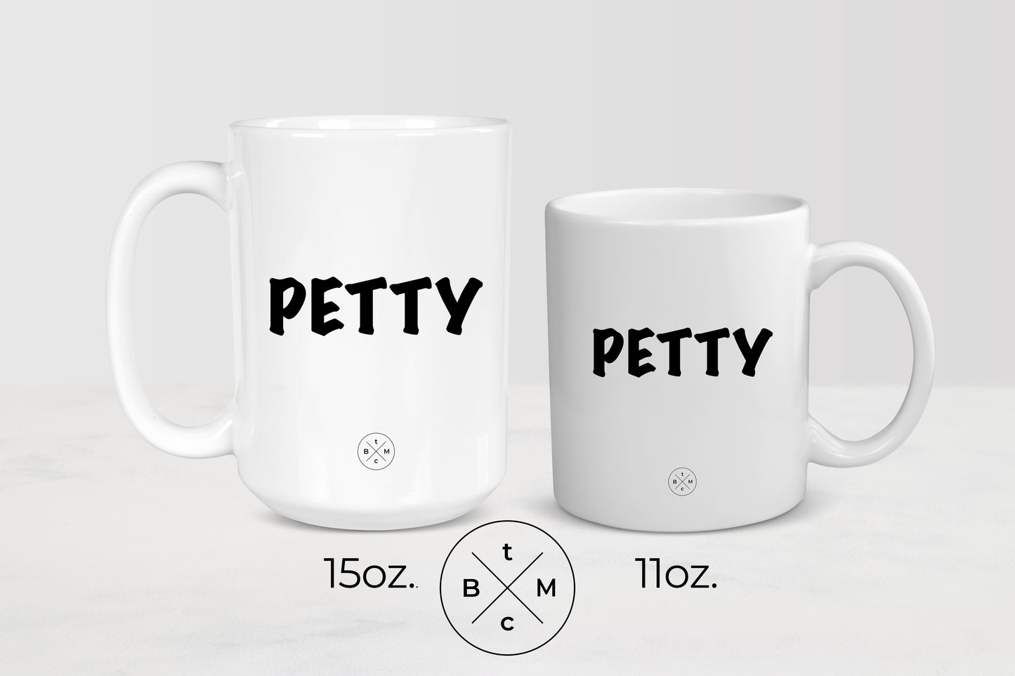 White 11 ounce and 15 ounce ceramic mugs with black text petty