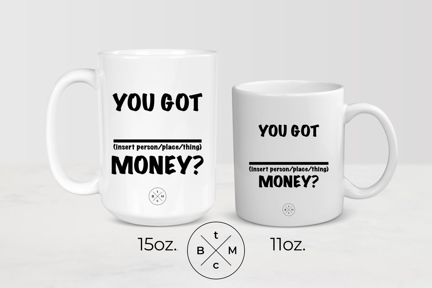11 ounce and 15 ounce white ceramic mugs with black text you got blank money