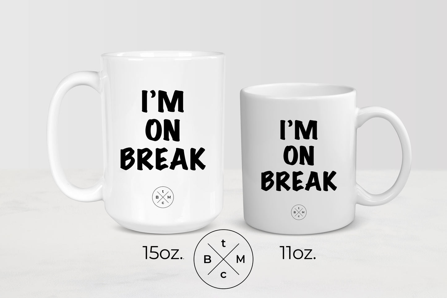 11 ounce and 15 ounce white ceramic mugs with black text I’m on break