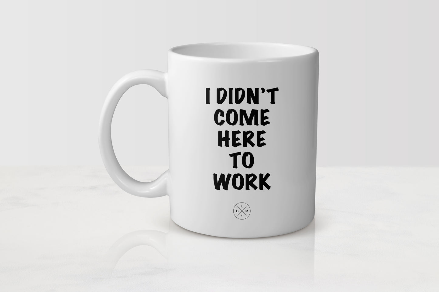 11 ounce white ceramic mug with black text I didn’t come to work
