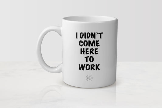 11 ounce white ceramic mug with black text I didn’t come to work