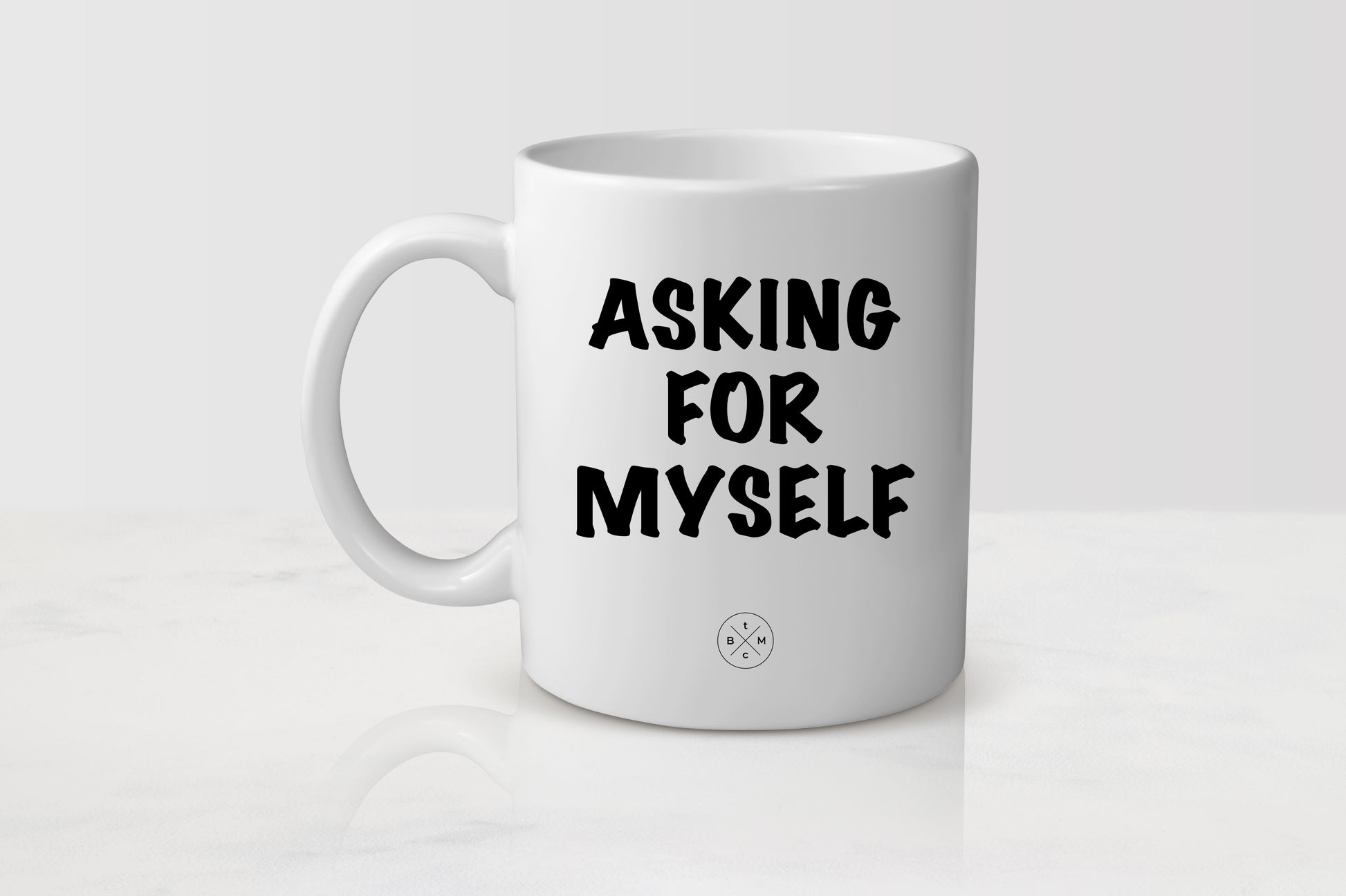White 11 ounce ceramic mug with black text asking for myself