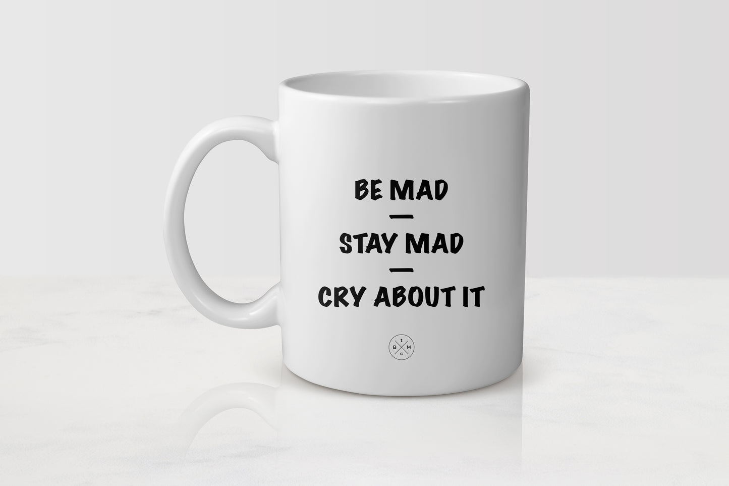 White 11 ounce ceramic mug with black text be mad stay mad cry about it