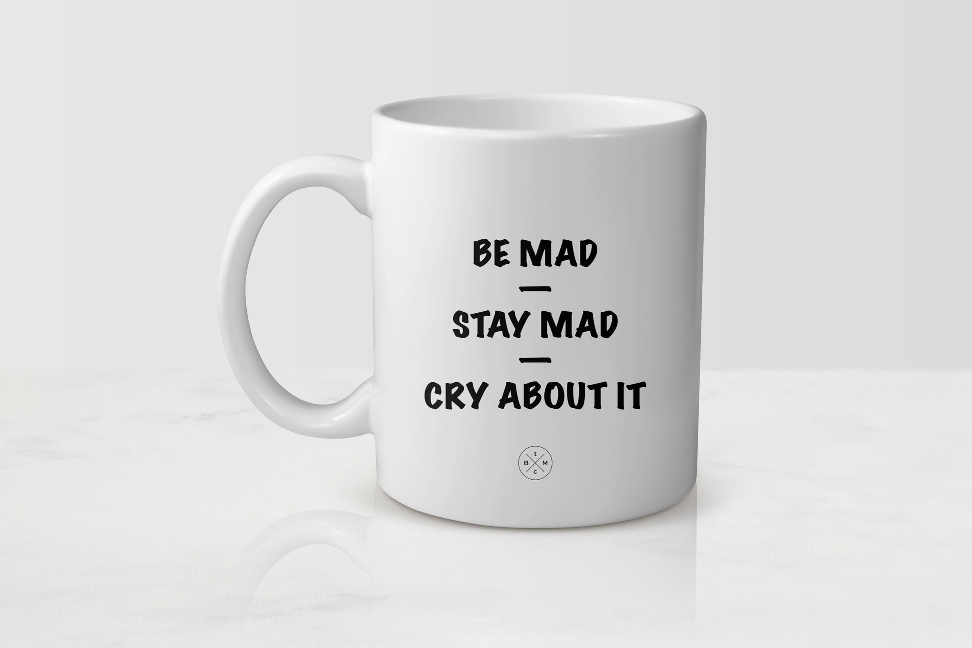 White 11 ounce ceramic mug with black text be mad stay mad cry about it