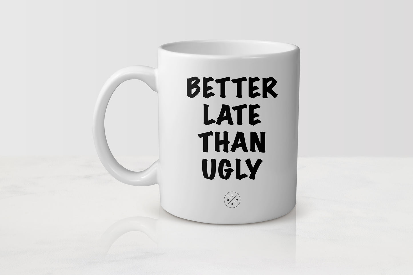 White 11 ounce ceramic mug with black text better late than ugly