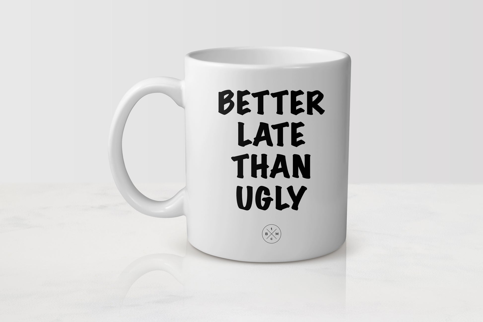 White 11 ounce ceramic mug with black text better late than ugly