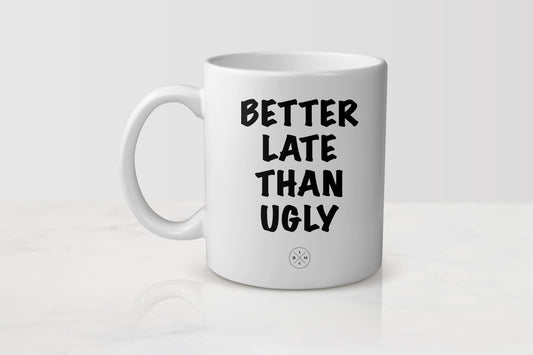 White 11 ounce ceramic mug with black text better late than ugly
