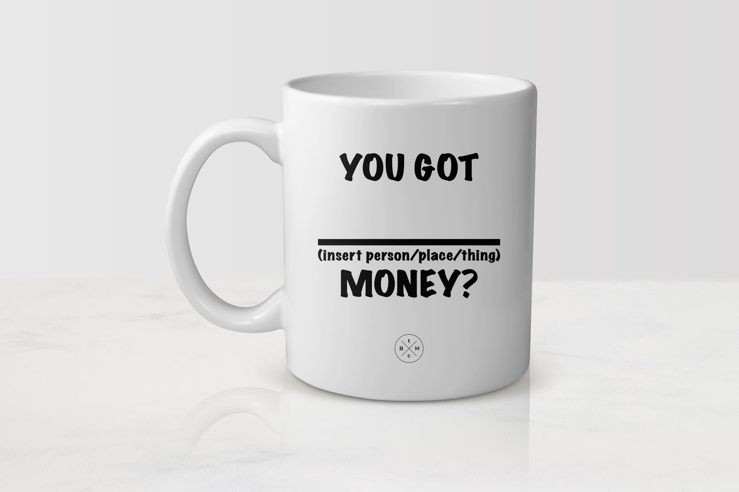 11 ounce white ceramic mug with black text you got blank money 