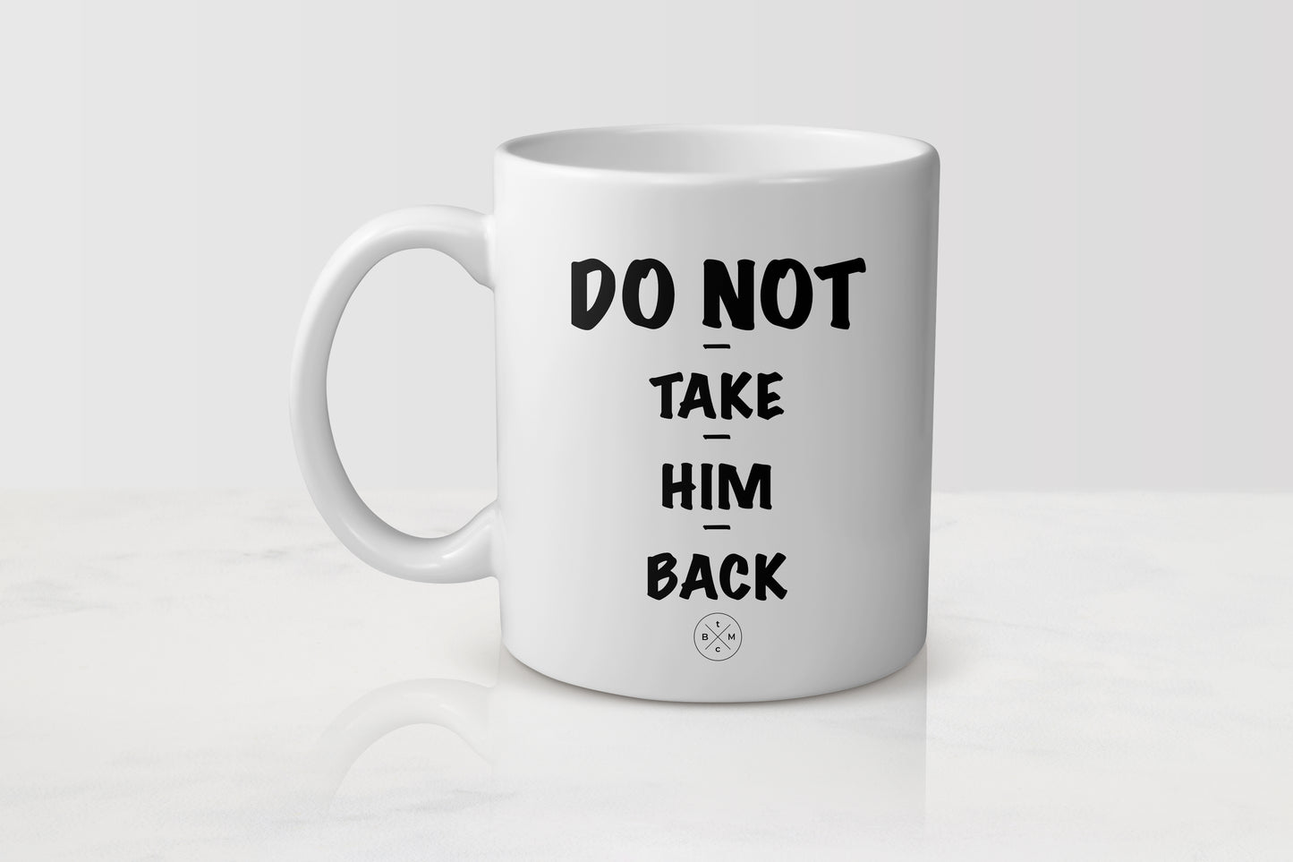 White 11 ounce ceramic mug with black text do not take him back