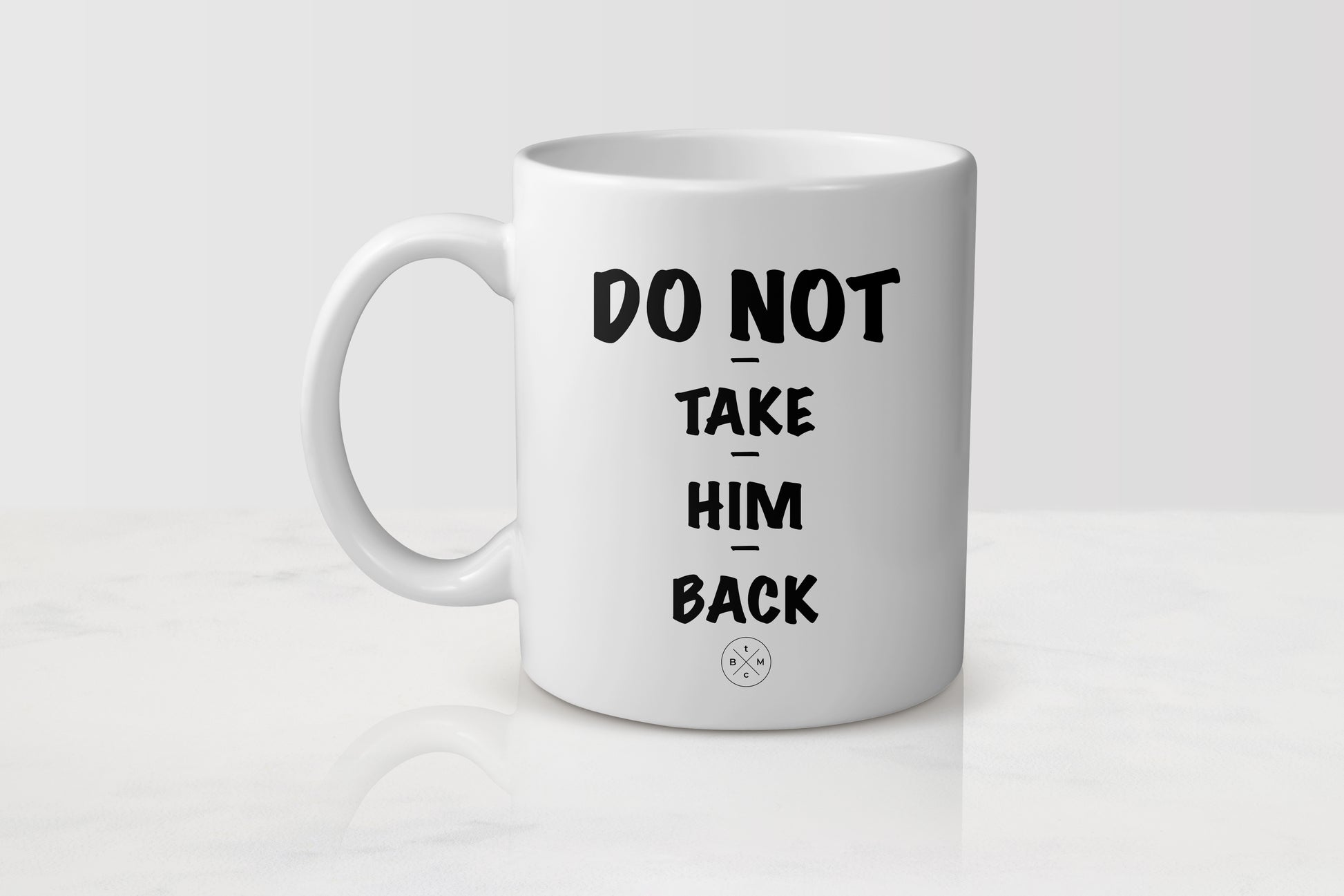 White 11 ounce ceramic mug with black text do not take him back