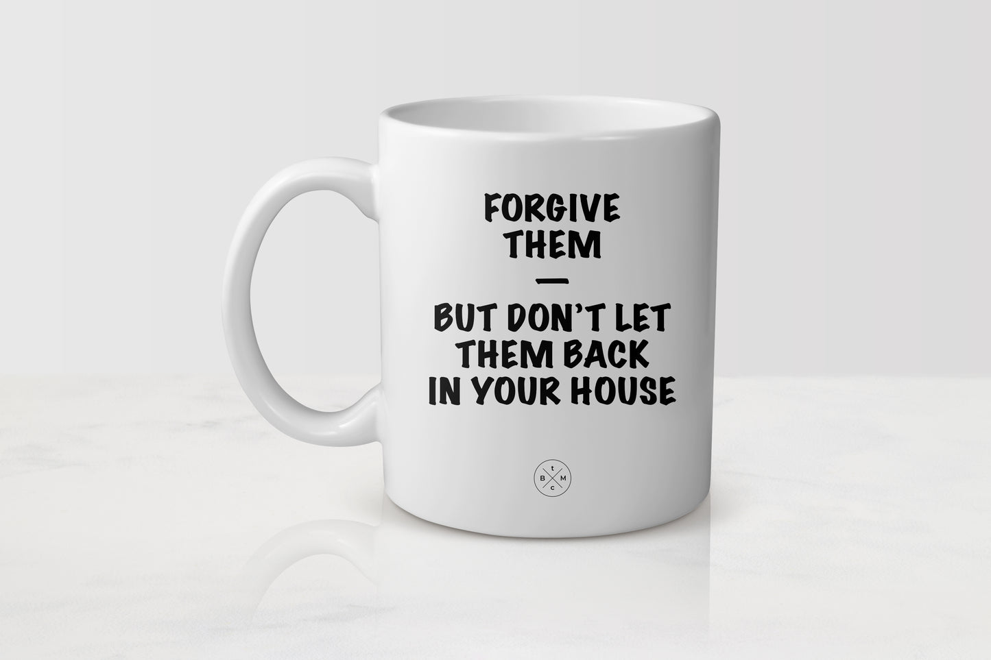 11 ounce white ceramic mug with black text forgive them but don’t let them back in your house