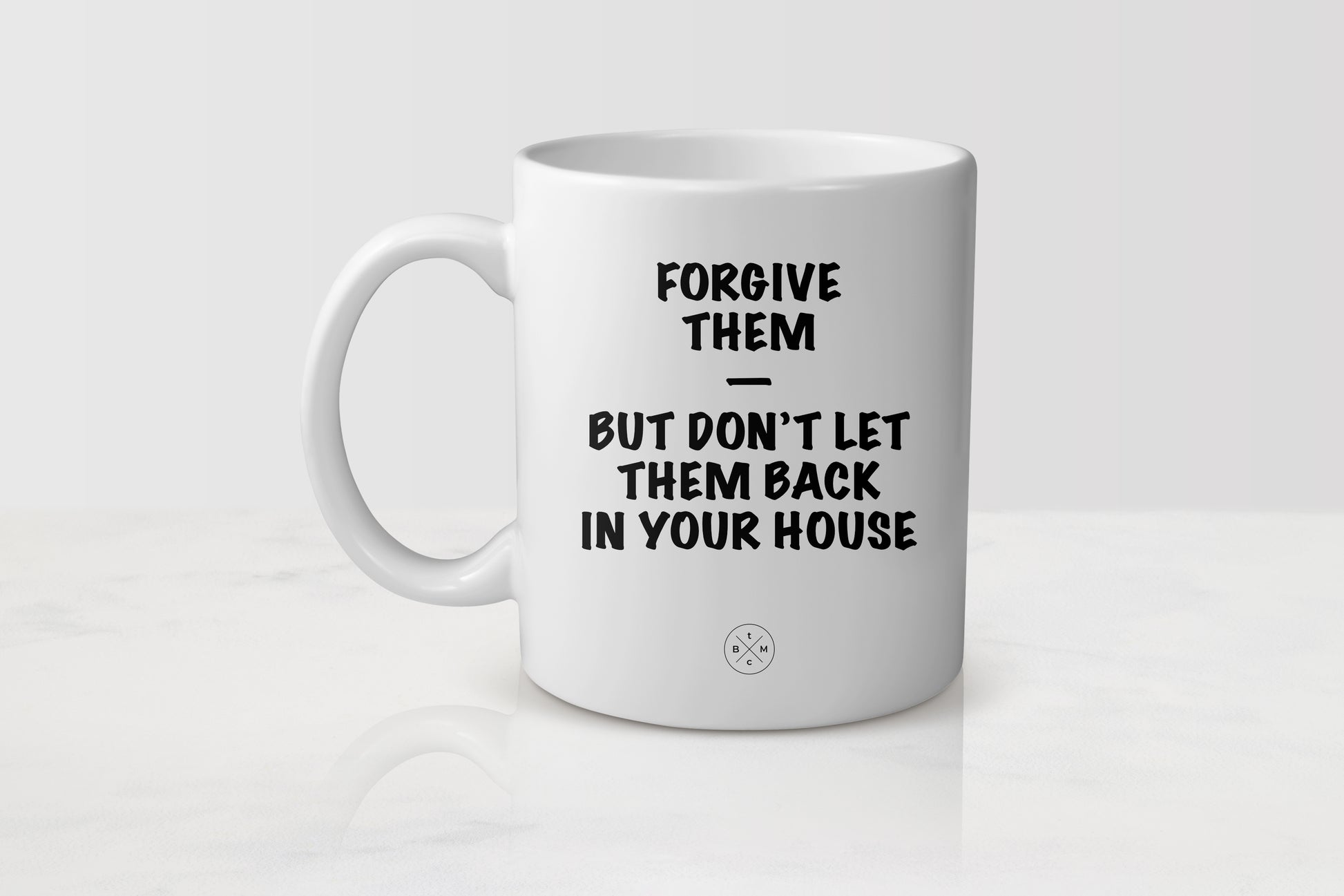 11 ounce white ceramic mug with black text forgive them but don’t let them back in your house
