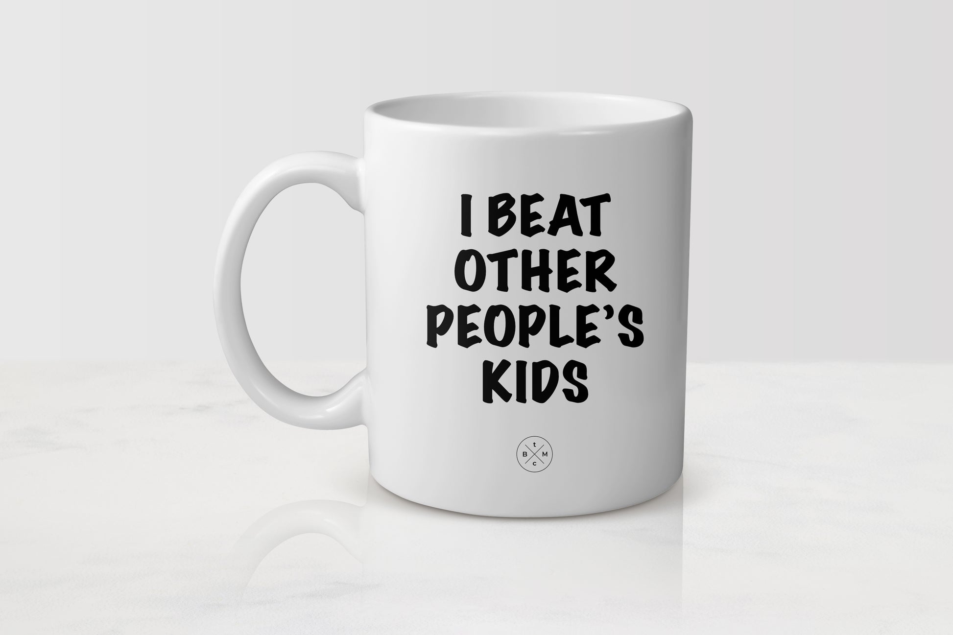 White 11 ounce ceramic mug with black text I beat other people’s kids