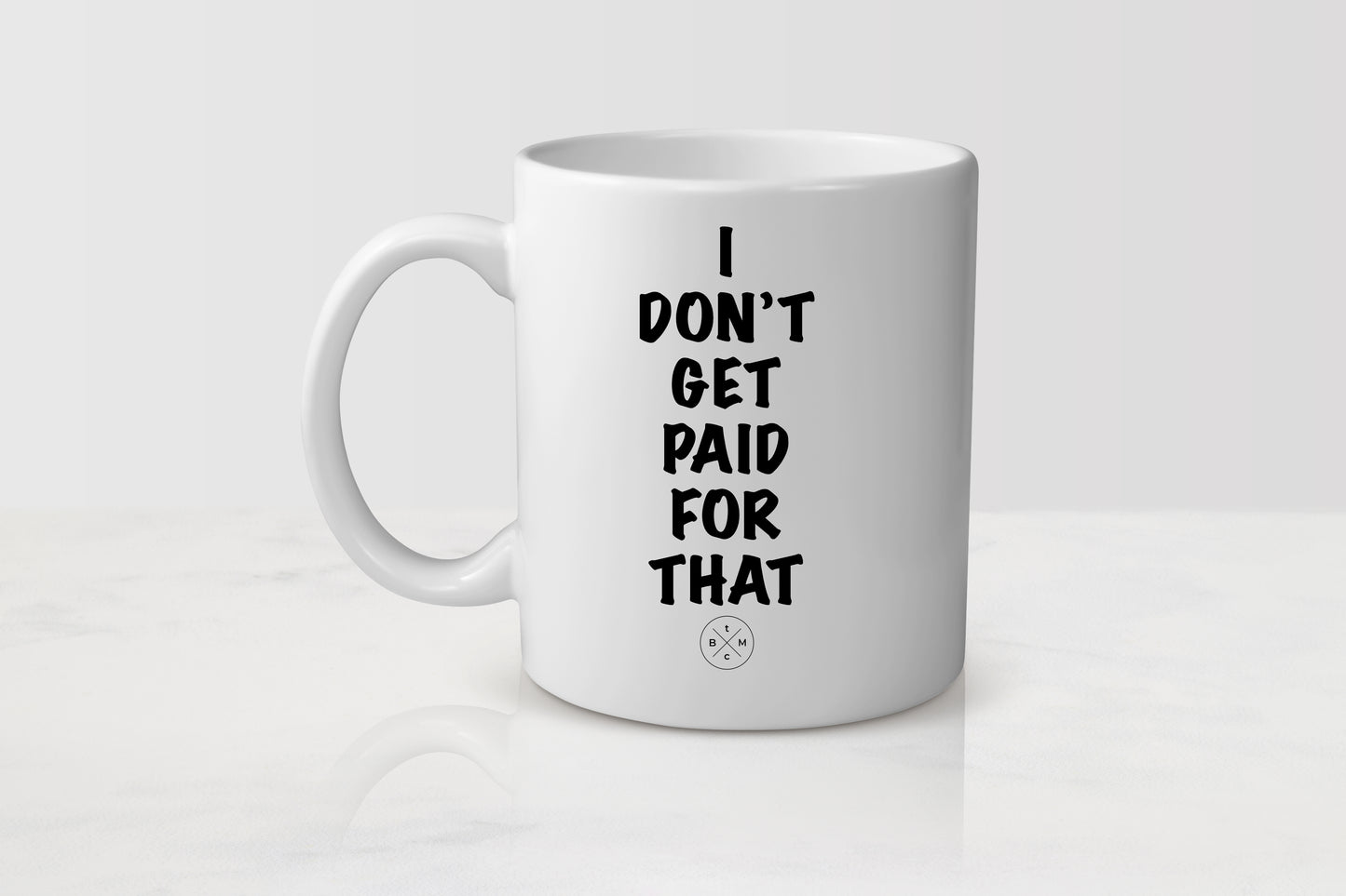11 ounce  white ceramic mug with black text I don’t get paid for that