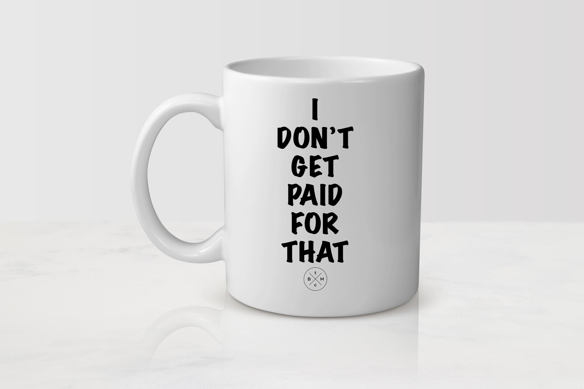 11 ounce  white ceramic mug with black text I don’t get paid for that