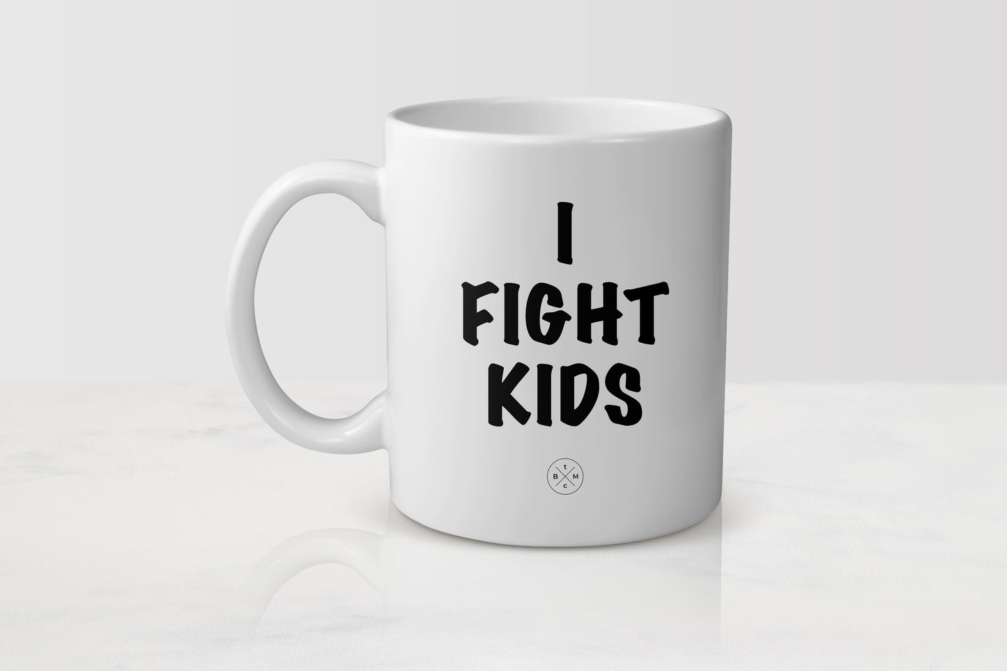 White 11 ounce ceramic mug with black text I fight kids