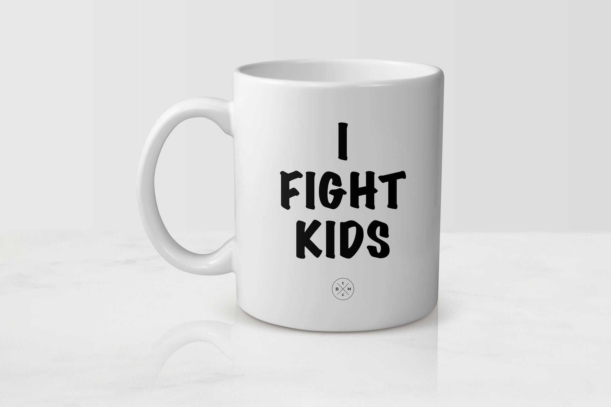 White 11 ounce ceramic mug with black text I fight kids
