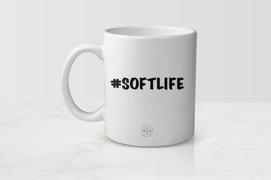 White 11 ounce ceramic mug with black text #SoftLife