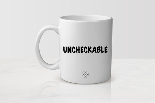White 11 ounce ceramic mug with black text uncheckable 
