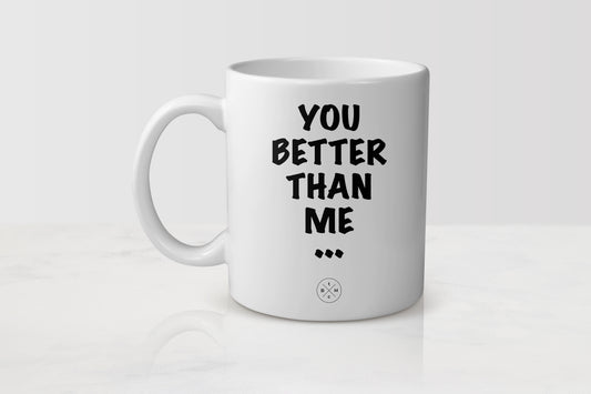 White 11 ounce ceramic mug with black text you better than me