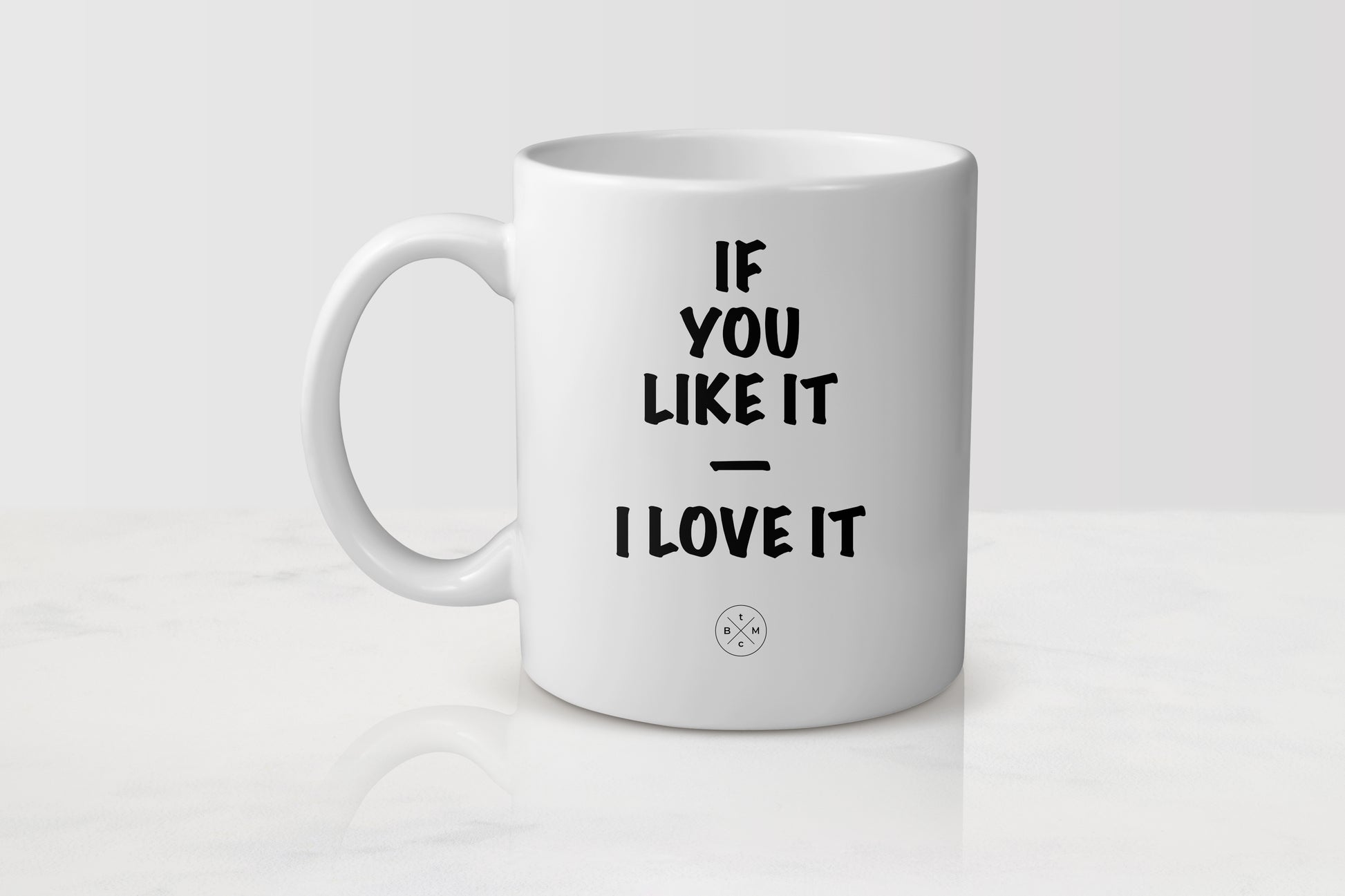 White 11 ounce ceramic mug with black text if you like it I love it