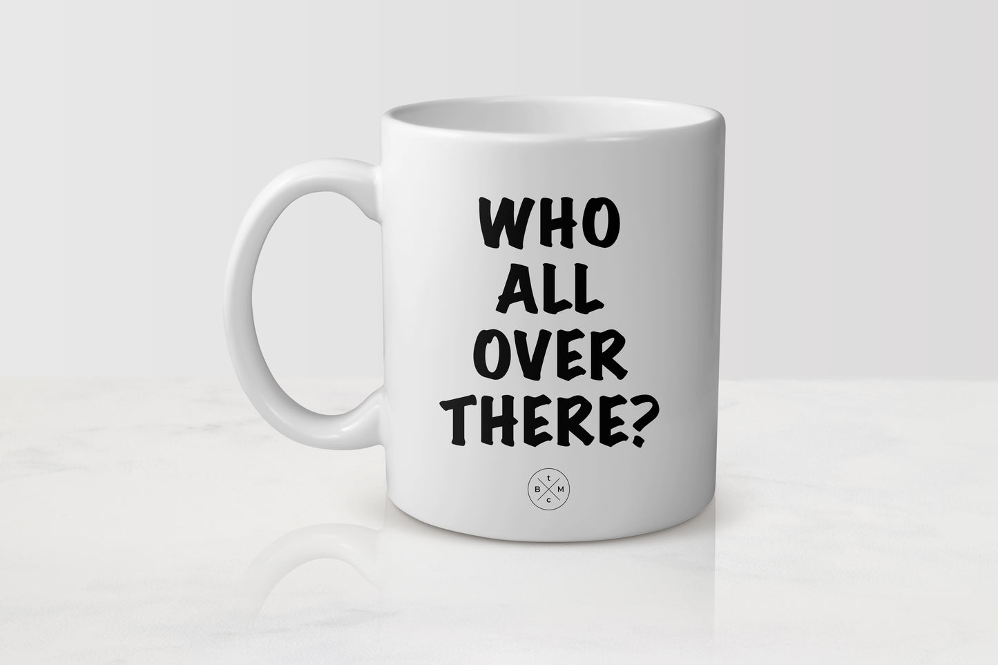 11 ounce white ceramic mug with black text who all over there?