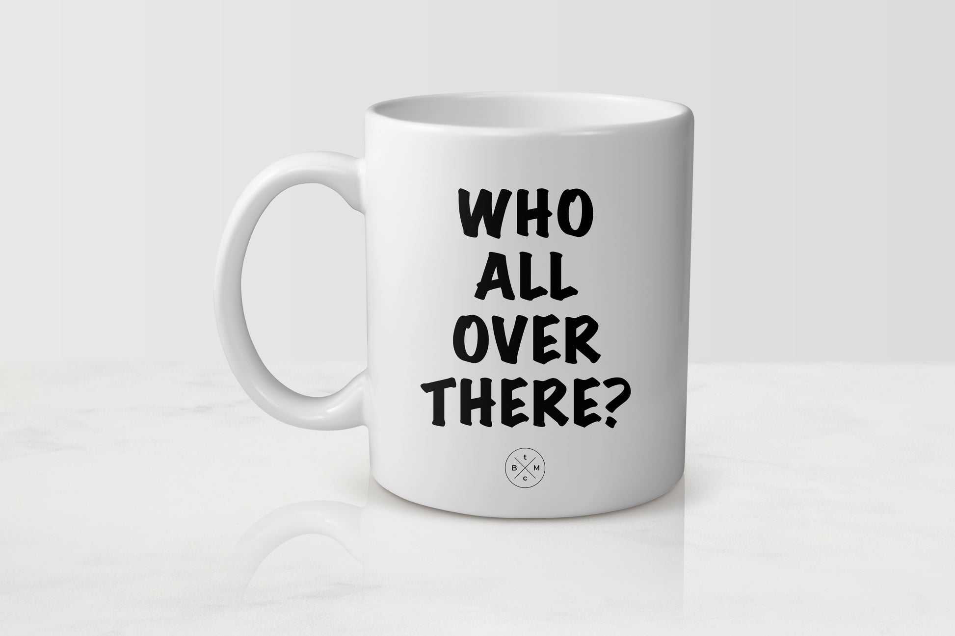 11 ounce white ceramic mug with black text who all over there?