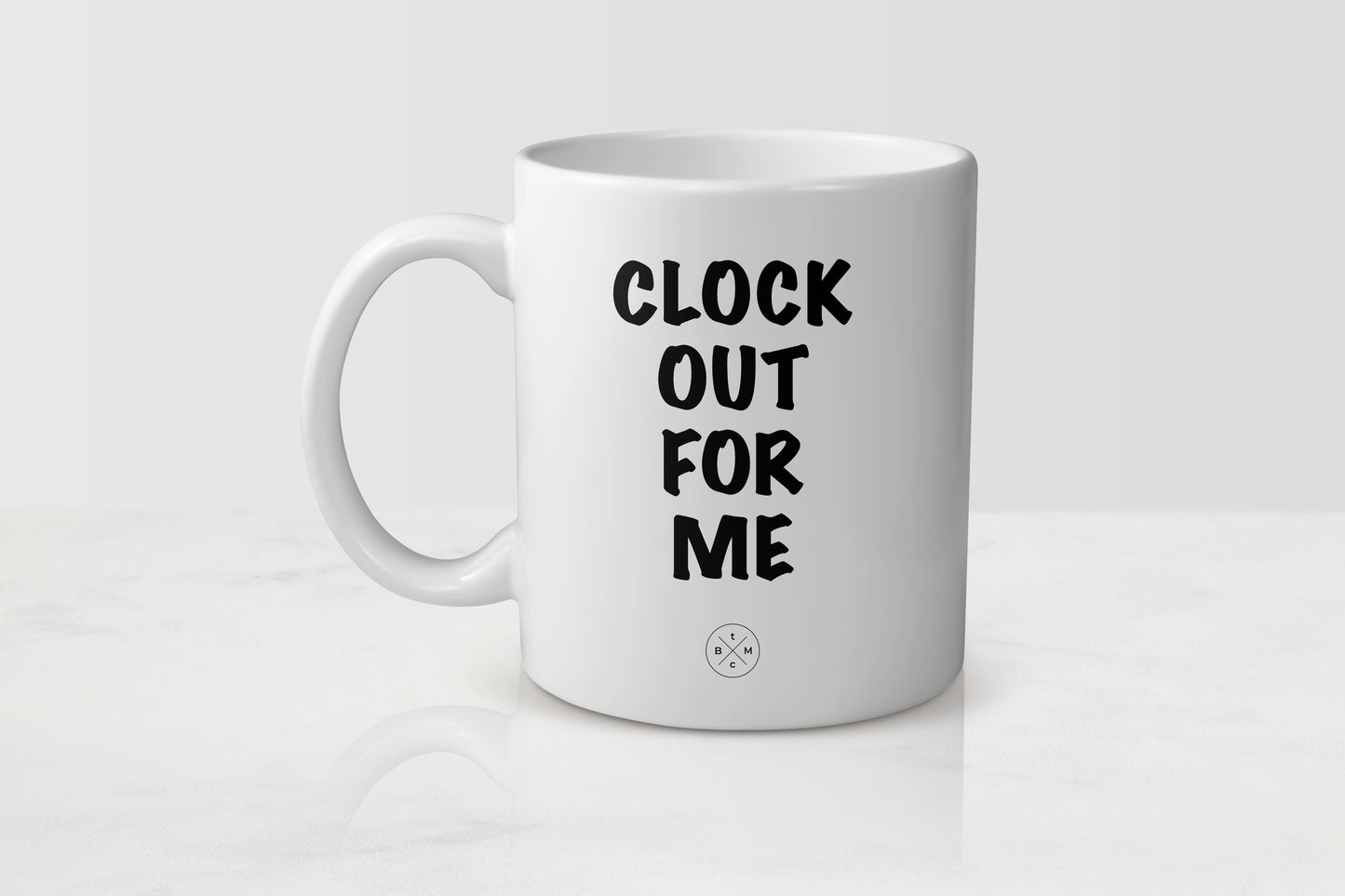 11 ounce white ceramic mug with black text clock out for me