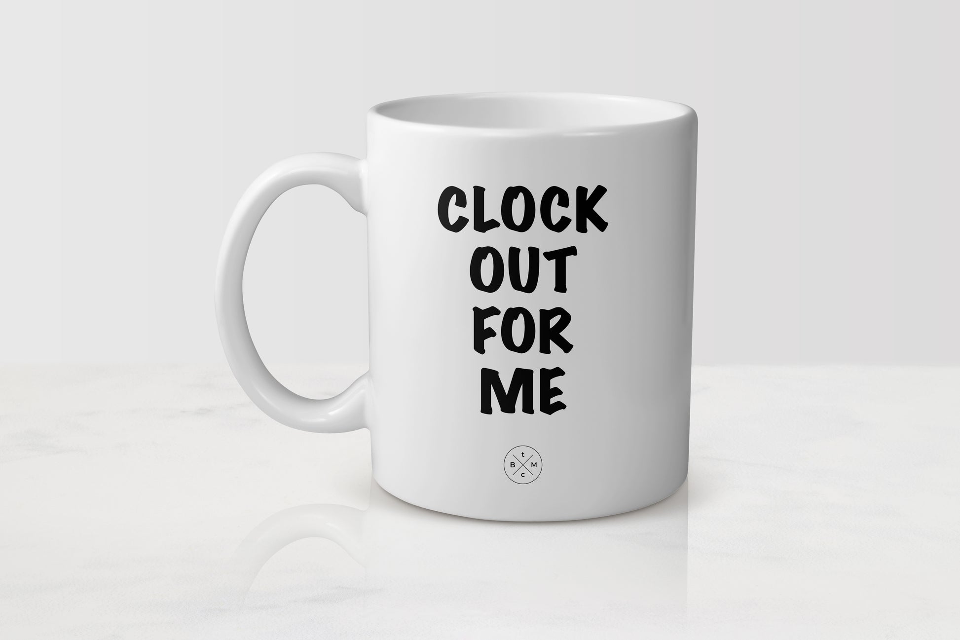 11 ounce white ceramic mug with black text clock out for me