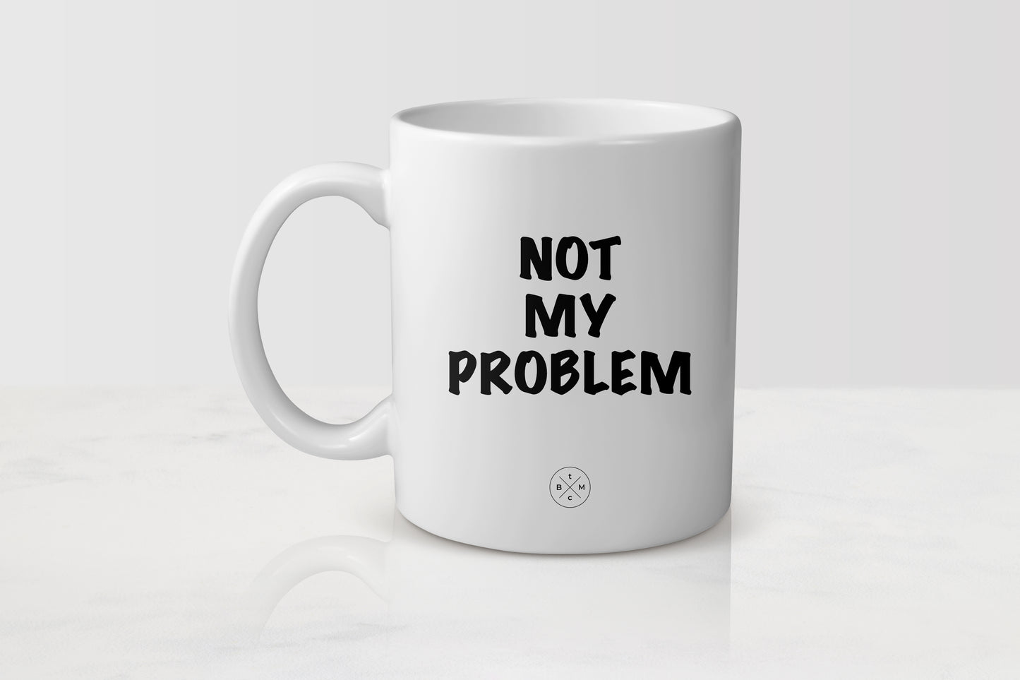 11 ounce white ceramic mug with black text not my problem
