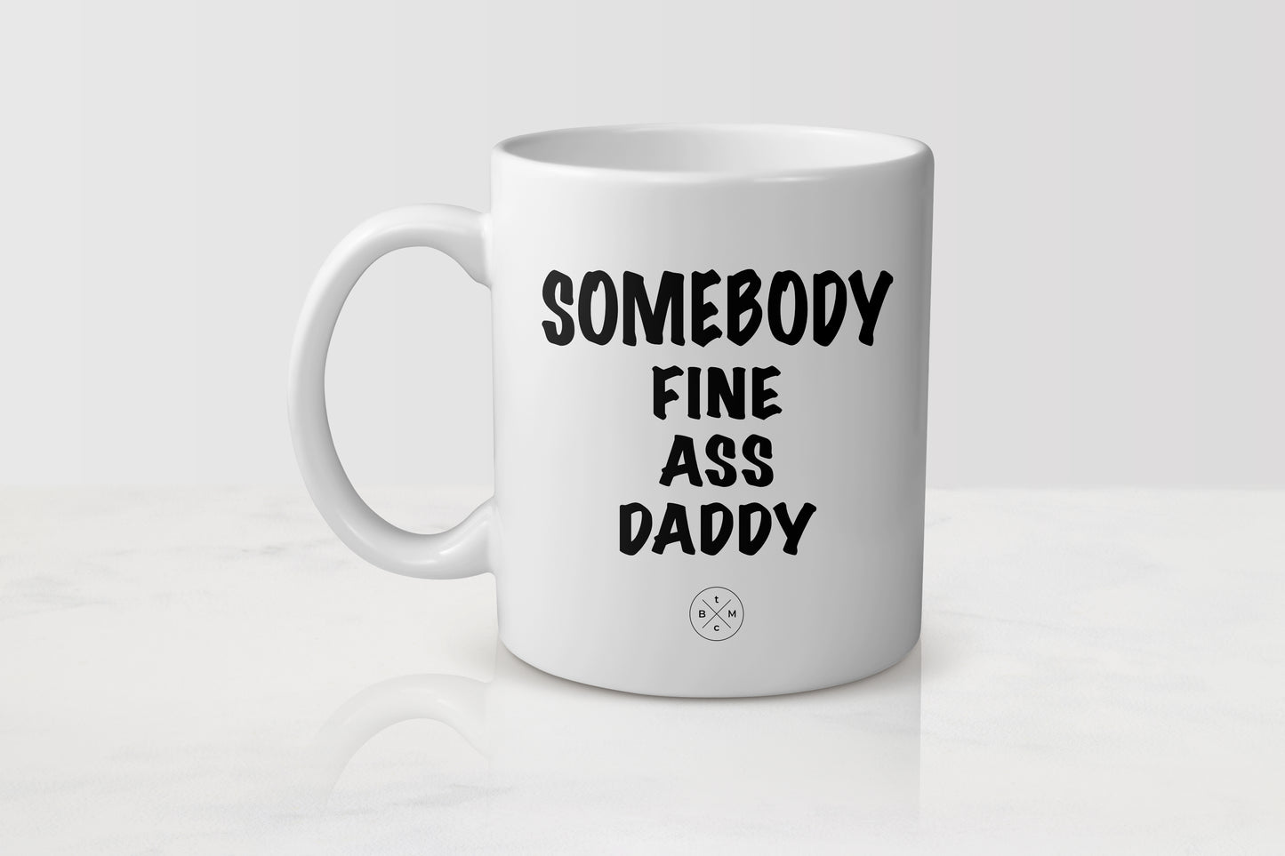 11 ounce white ceramic mug with black text somebody fine ass daddy