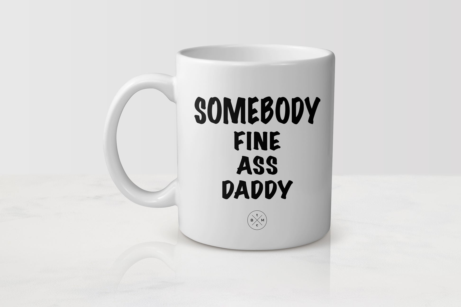 11 ounce white ceramic mug with black text somebody fine ass daddy
