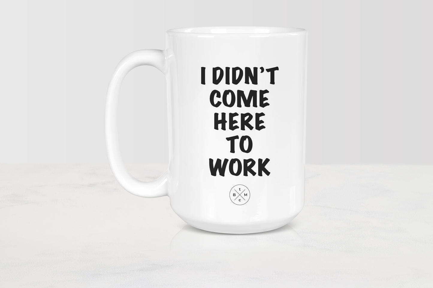 15 ounce white ceramic mug with black text I didn’t come to work