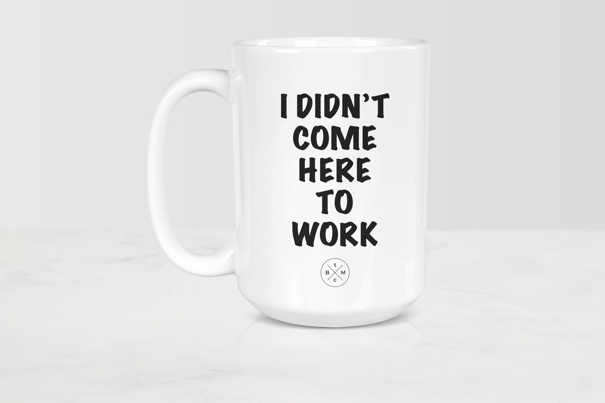 15 ounce white ceramic mug with black text I didn’t come to work