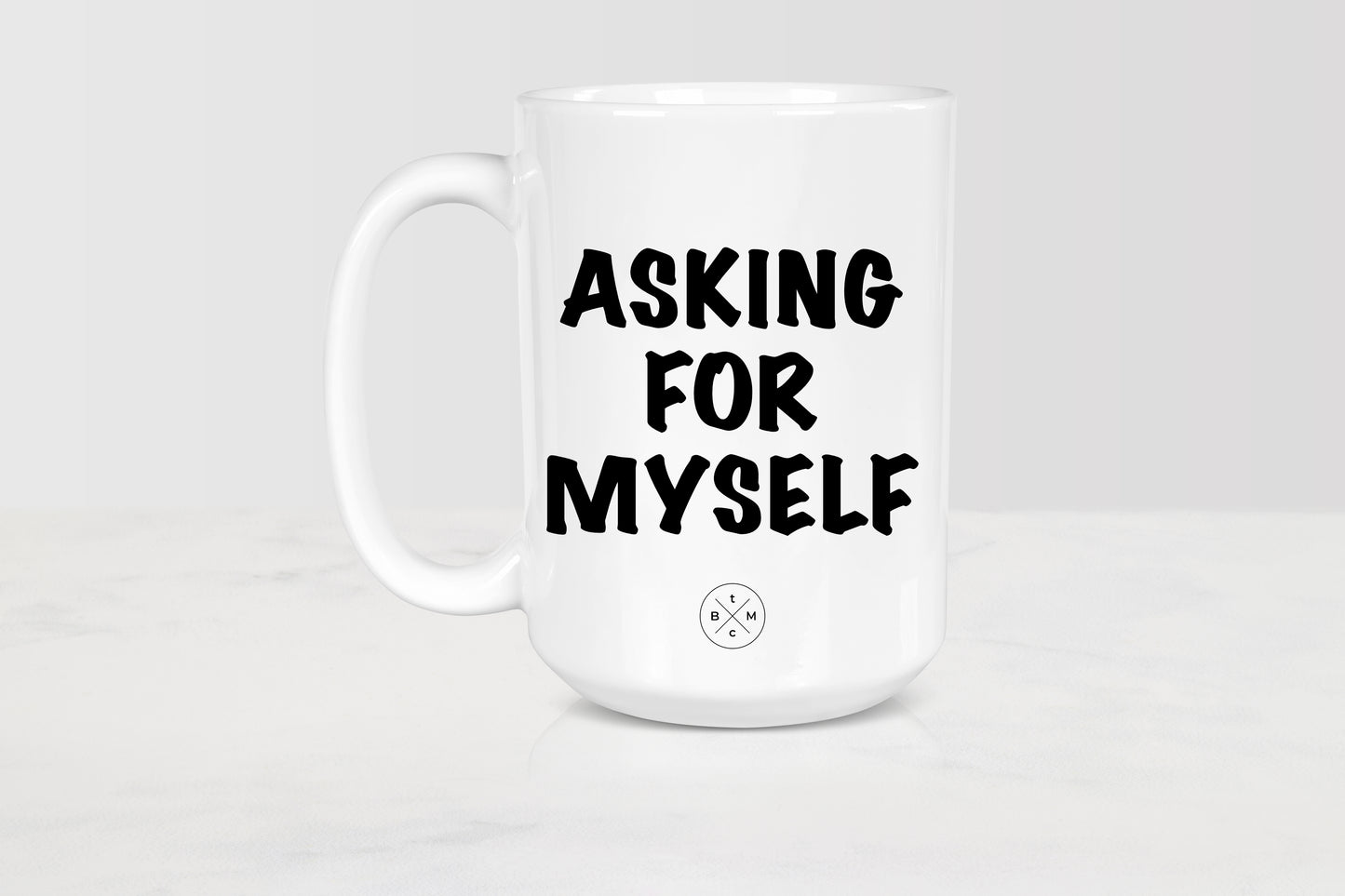 White 15 ounce ceramic mug with black text asking for myself