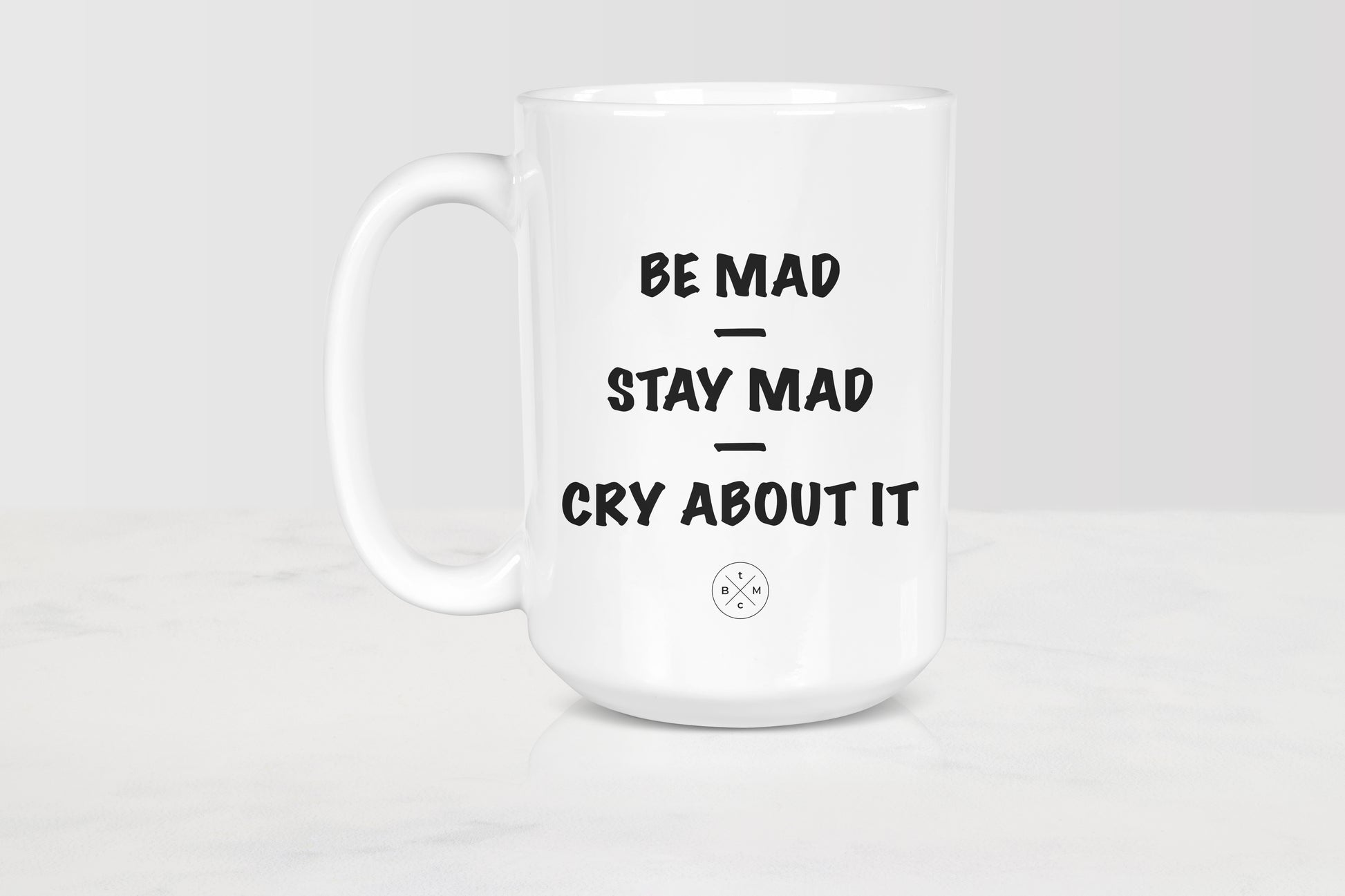 White 15 ounce ceramic mug with black text be mad stay mad cry about it