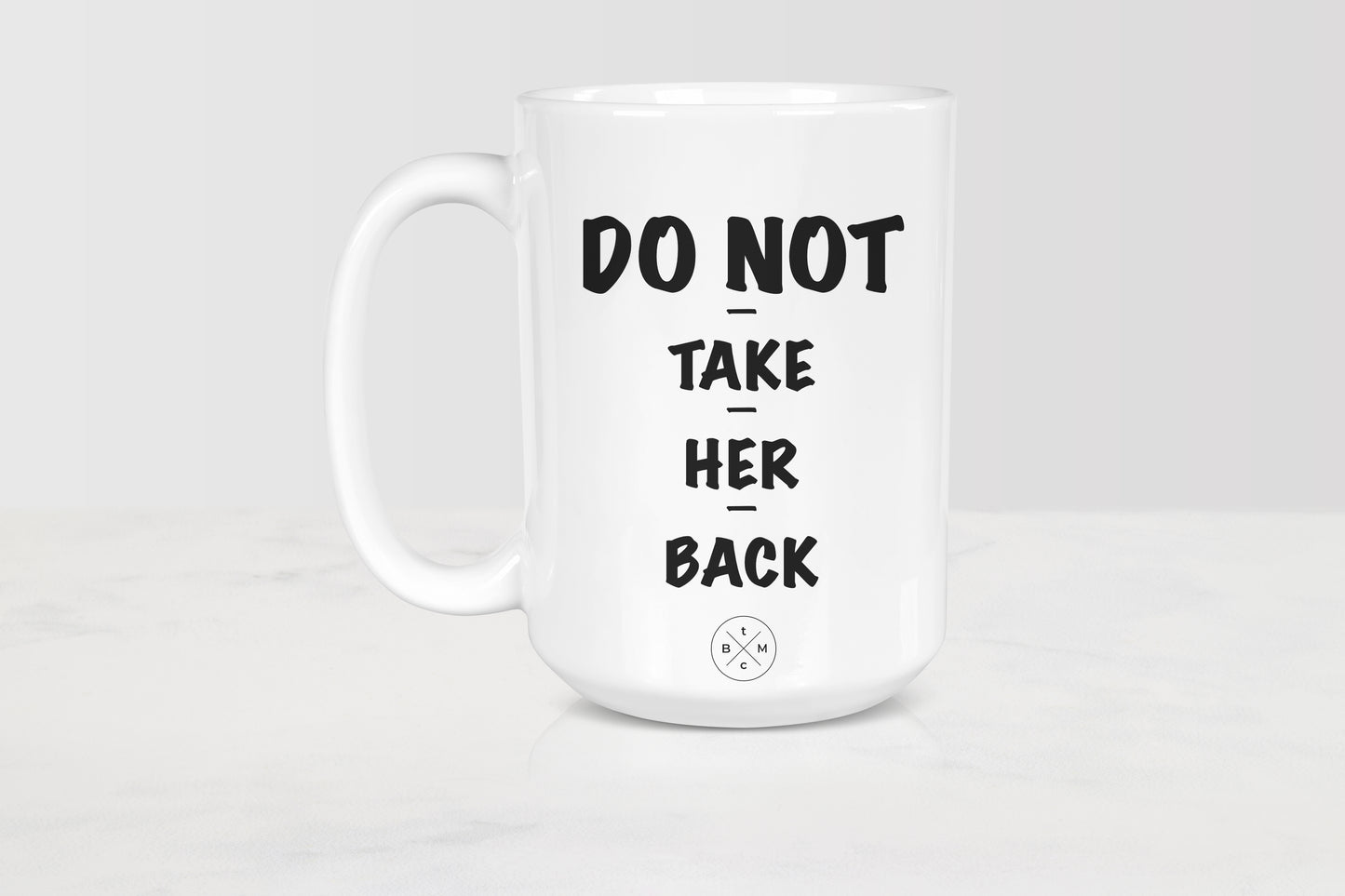 White 15 ounce ceramic mug with black text do not take her back