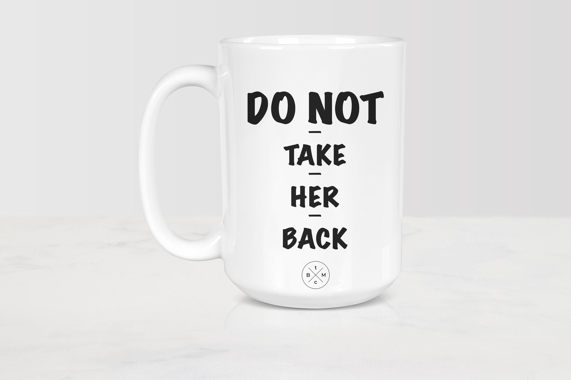 White 15 ounce ceramic mug with black text do not take her back