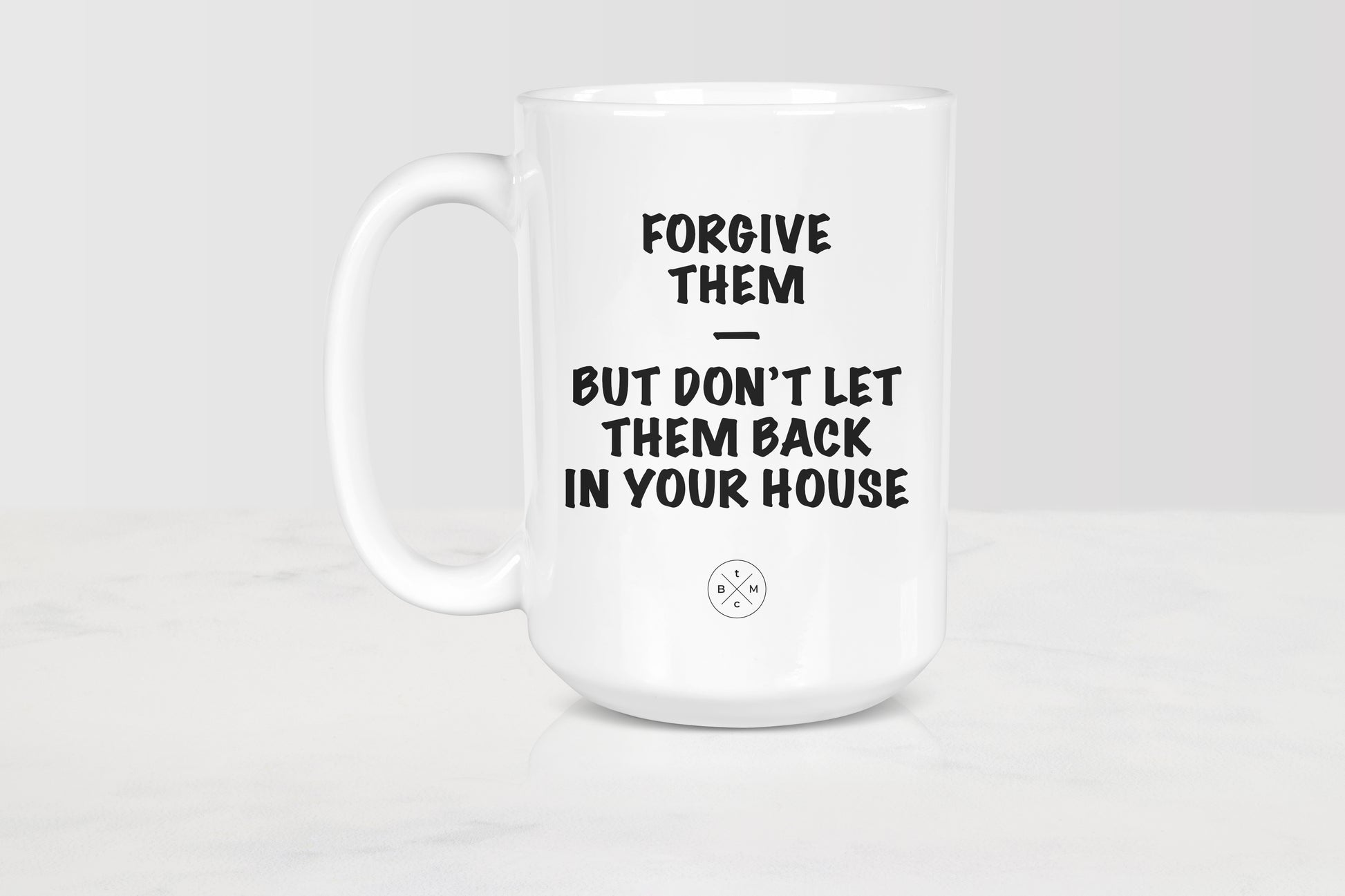 15 ounce white ceramic mug with black text forgive them but don’t let them back in your house