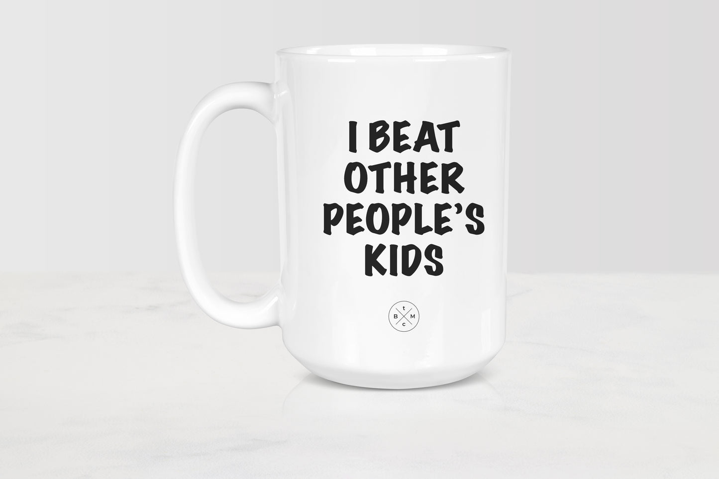 White 15 ounce ceramic mug with black text I beat other people’s kids