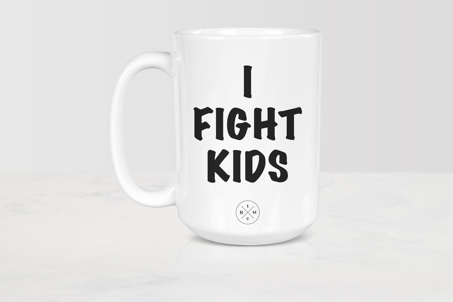 White 15 ounce ceramic mug with black text I fight kids