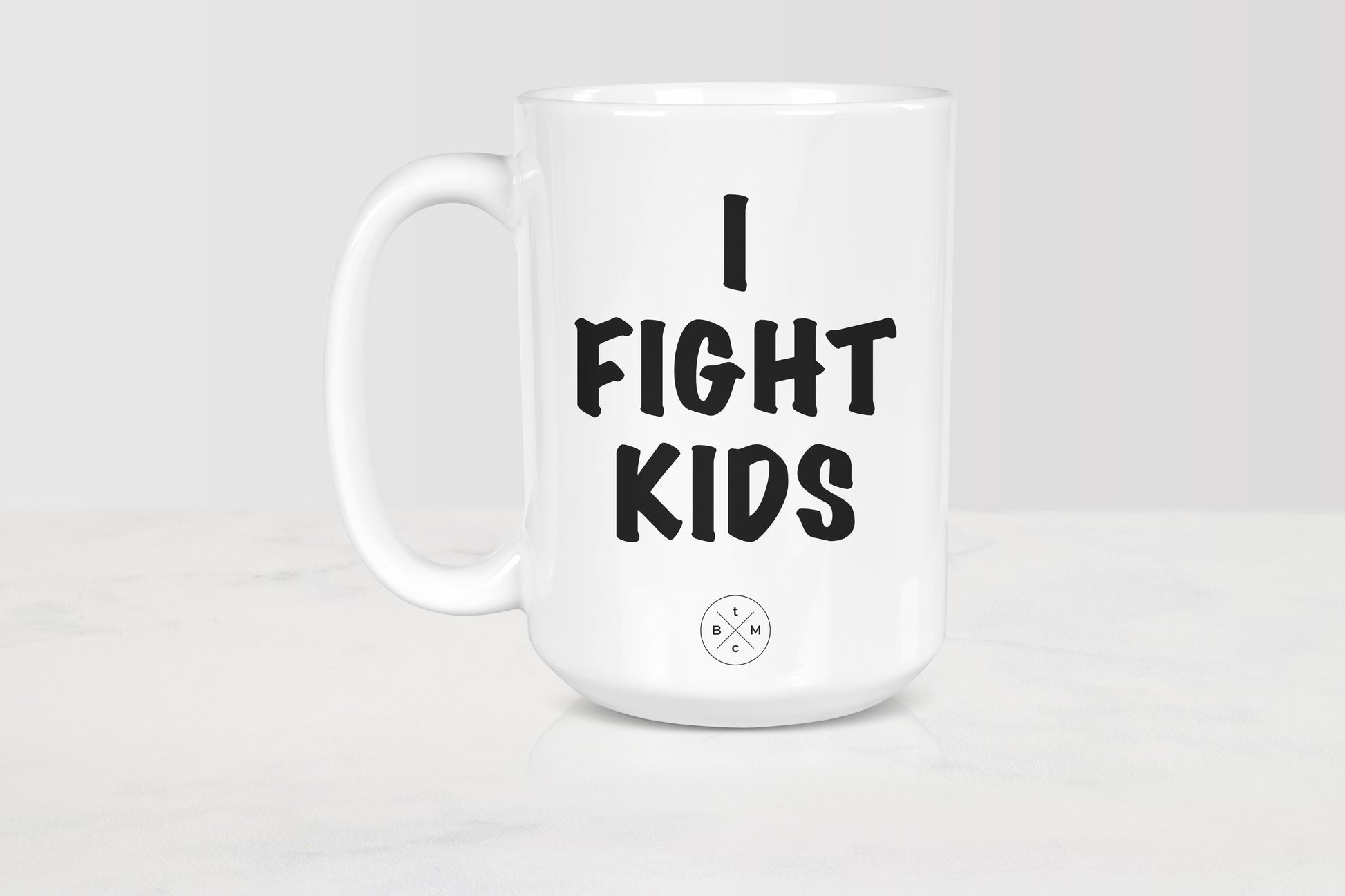 White 15 ounce ceramic mug with black text I fight kids