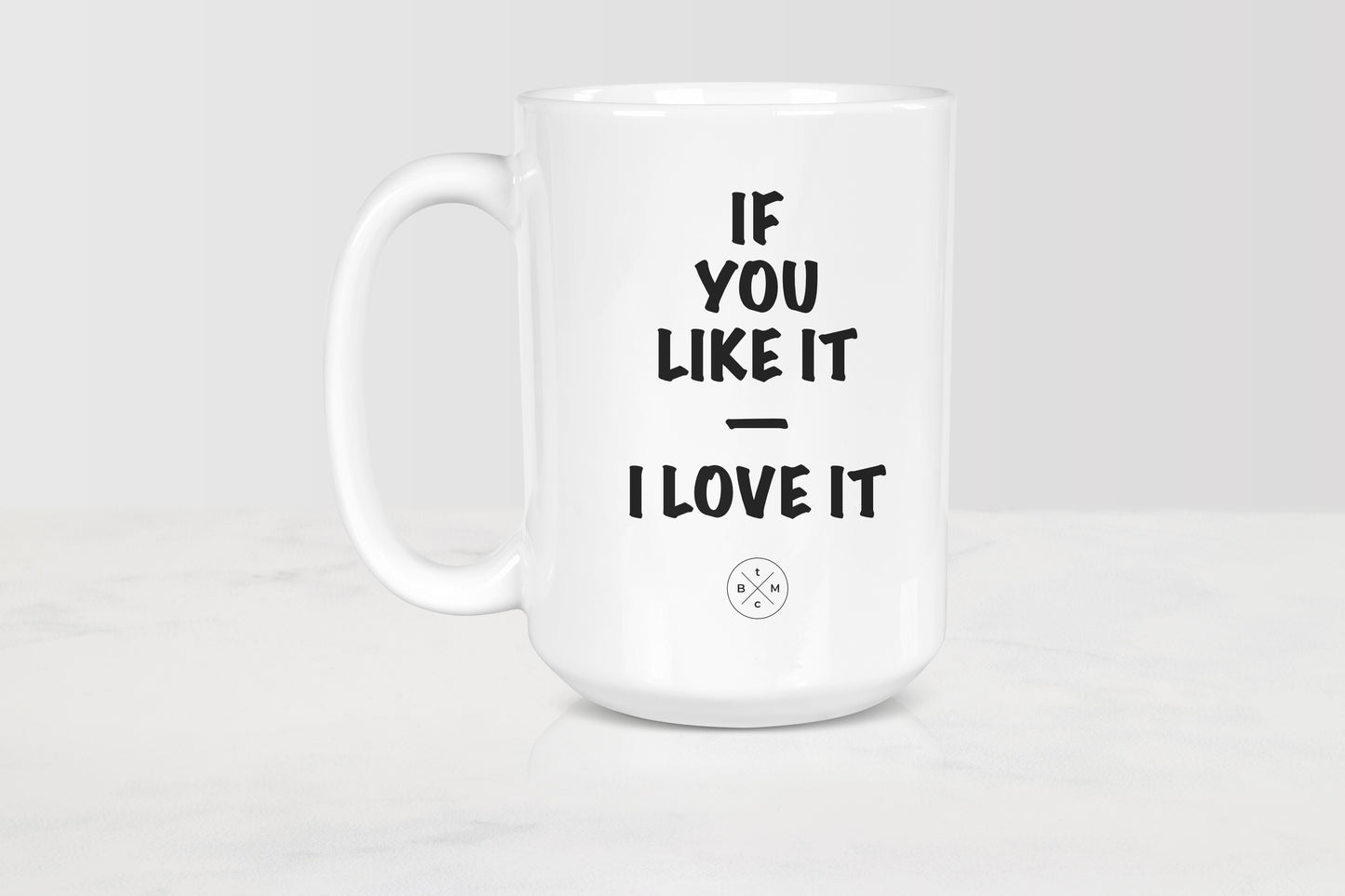 White 15 ounce ceramic mug with black text if you like it I love it