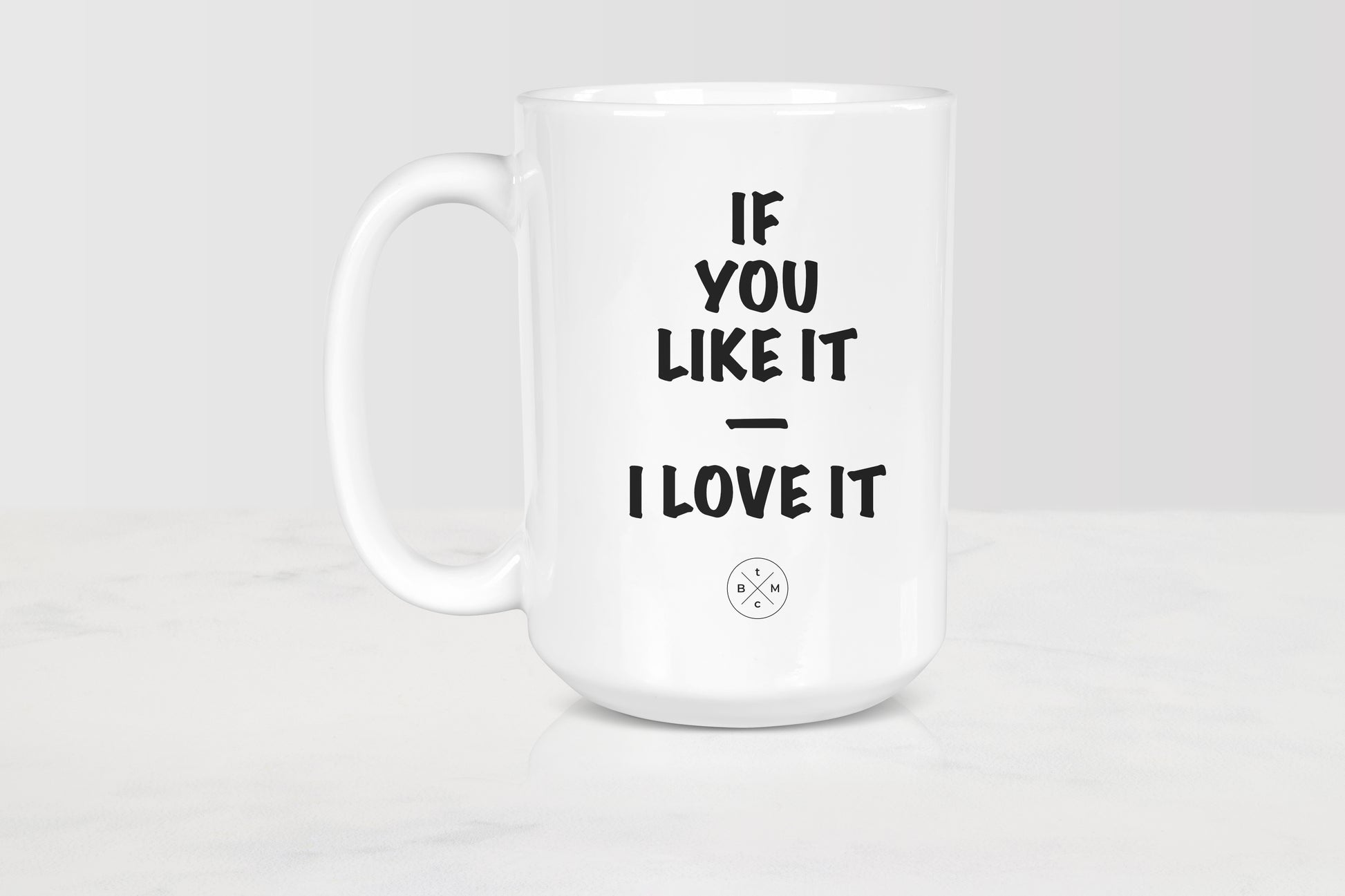 White 15 ounce ceramic mug with black text if you like it I love it