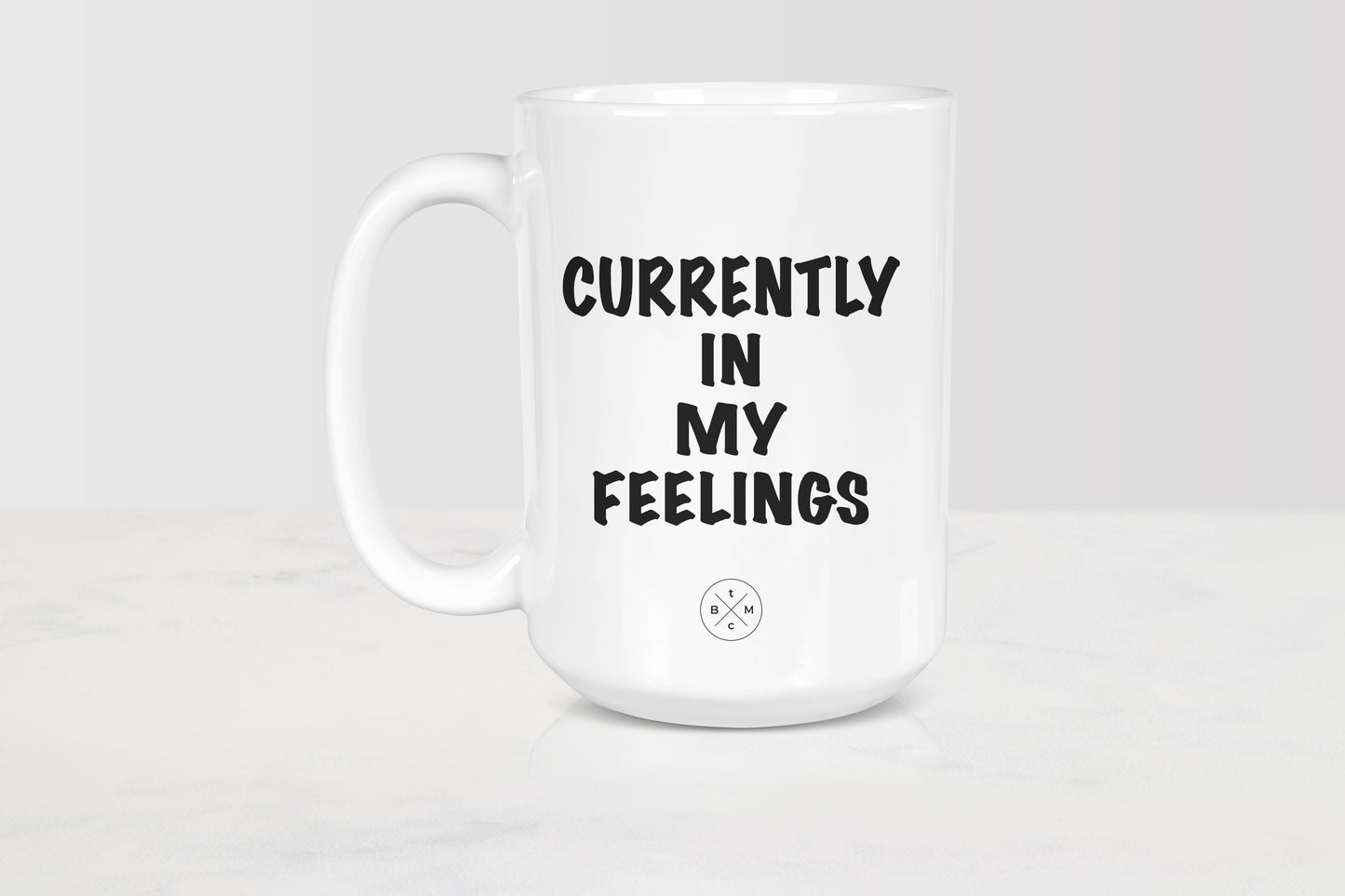 15 ounce white ceramic mug with black text currently in my feelings