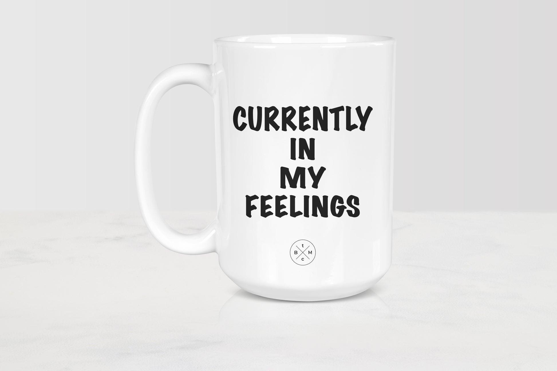 15 ounce white ceramic mug with black text currently in my feelings