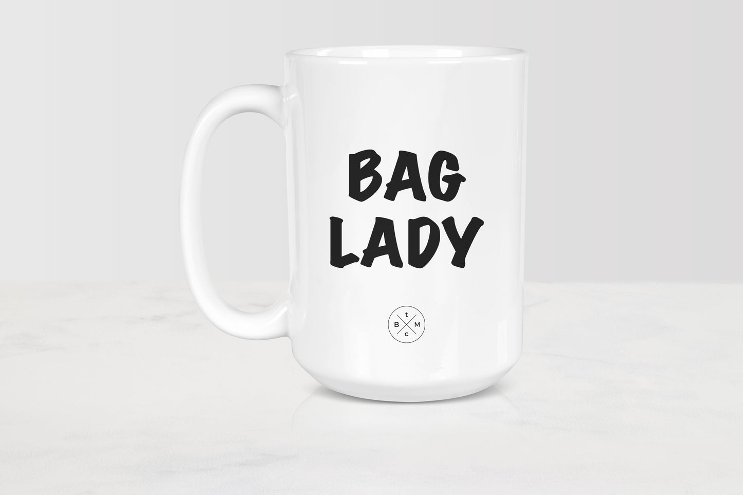 15 ounce white ceramic mug with black text bag lady