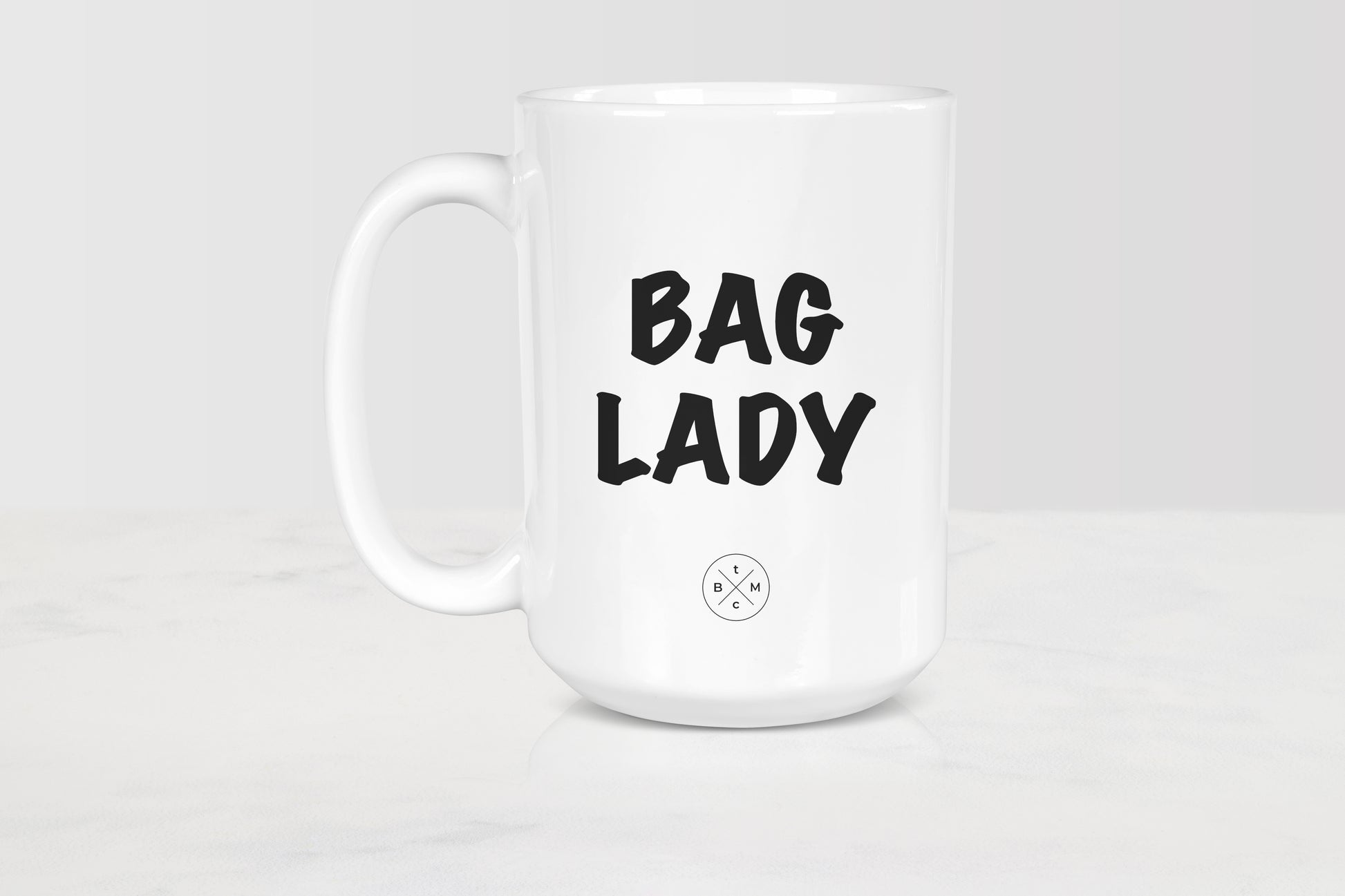 15 ounce white ceramic mug with black text bag lady