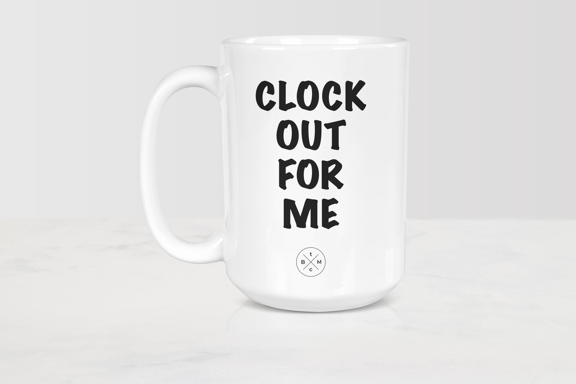 15 ounce white ceramic mug with black text clock out for me